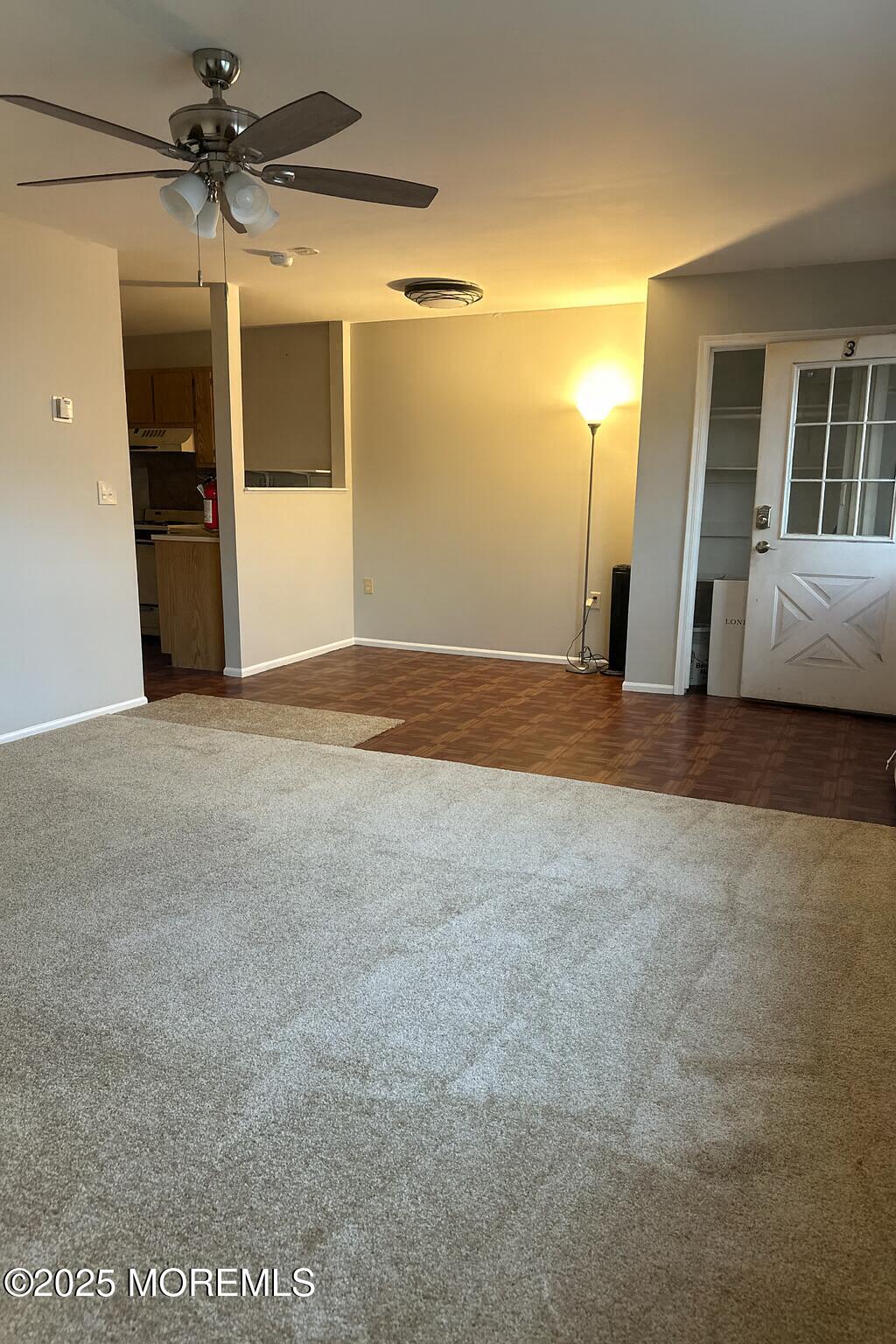 273 Port Monmouth Road, Unit 3 Middletown, NJ 07748 - Photo 2 of 6 a view of a big room with closet and chandelier fan