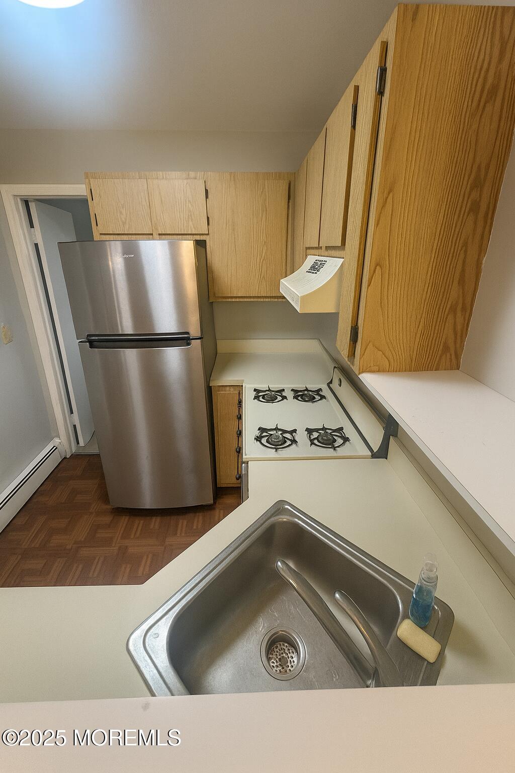 273 Port Monmouth Road, Unit 3 Middletown, NJ 07748 - Photo 3 of 6 a kitchen with a sink a refrigerator and a stove