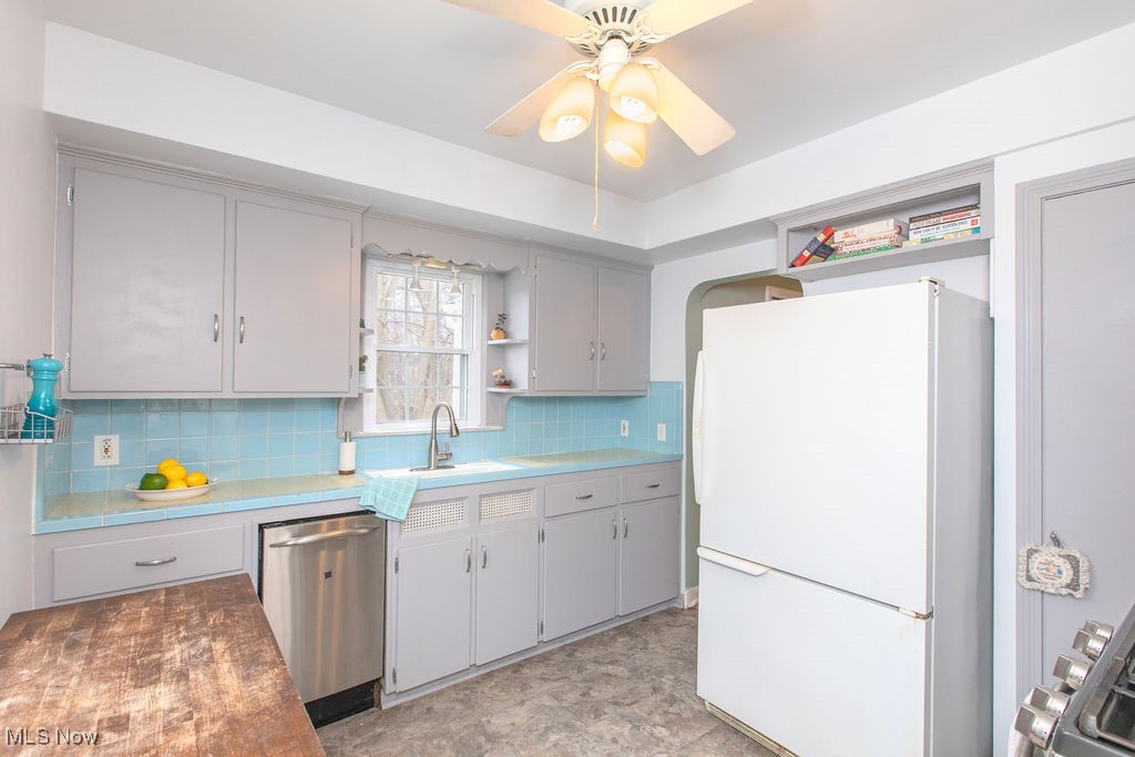 3244 Berkeley Road Cleveland, OH 44118 - Photo 7 of 16 Another view of the kitchen showing the dishwasher and refrigerator.