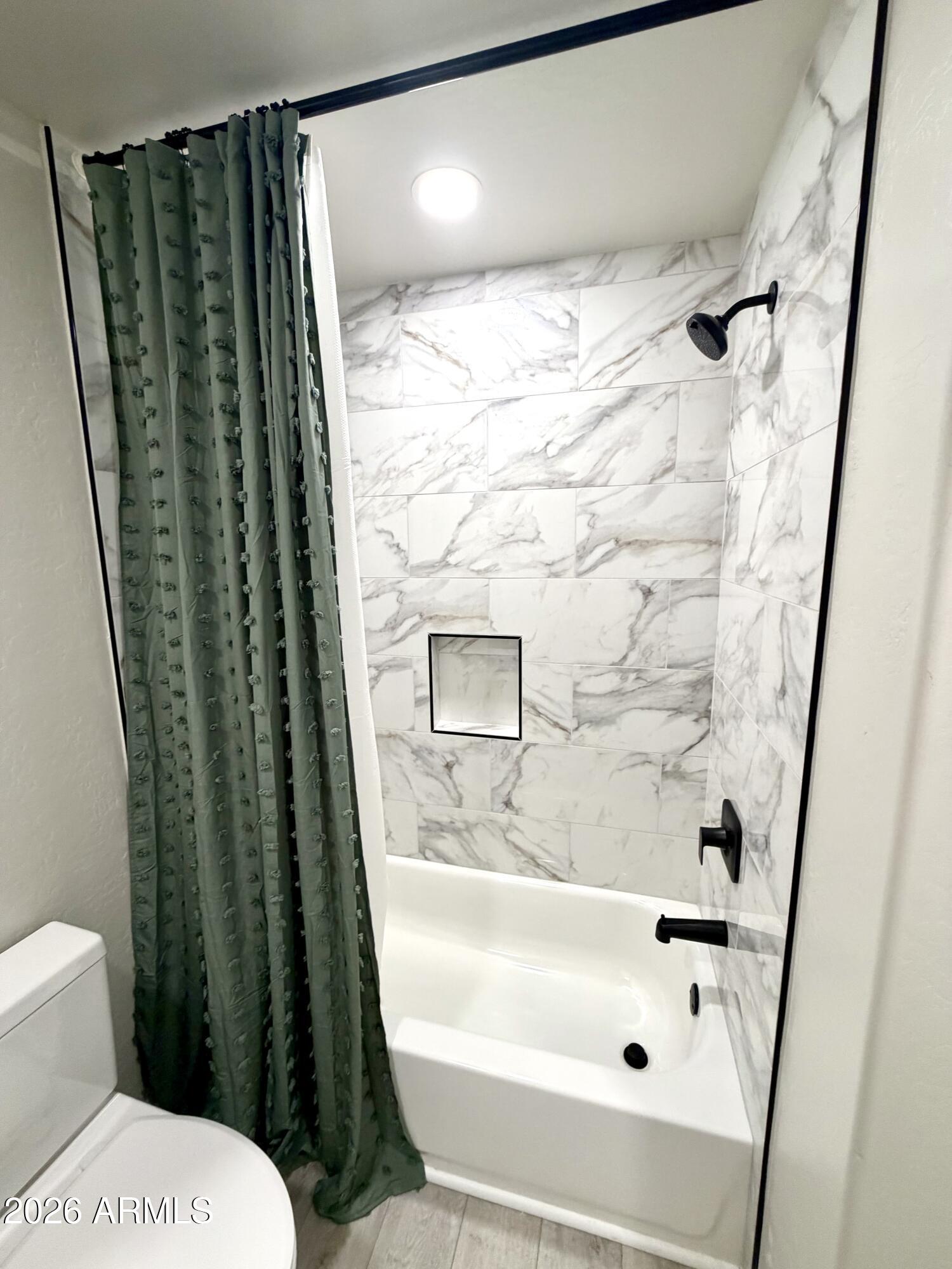 1165 North Mountain View Road Apache Junction, AZ 85119 - Photo 19 of 29 a bathroom with a shower and a toilet