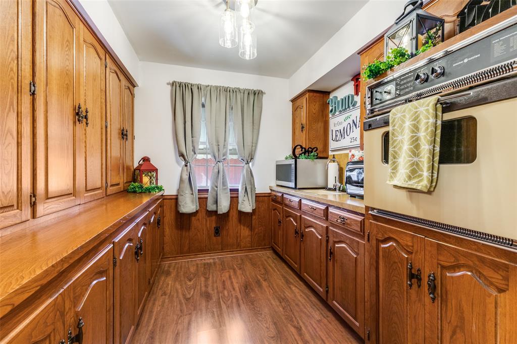 10615 Old Seagoville Road Dallas, TX 75217 - Photo 12 of 33 a very nice looking room with wooden floor and furniture