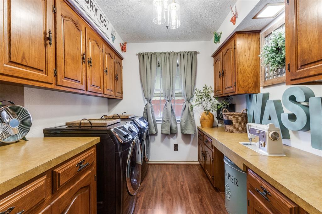 10615 Old Seagoville Road Dallas, TX 75217 - Photo 13 of 33 a kitchen with stainless steel appliances granite countertop a sink stove and cabinets