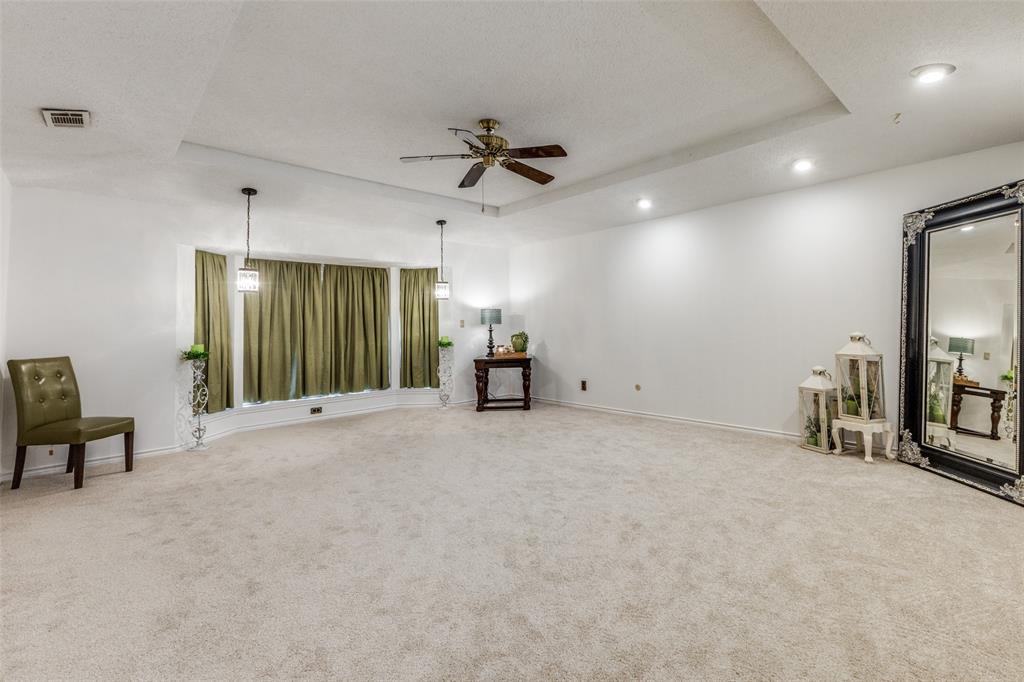 10615 Old Seagoville Road Dallas, TX 75217 - Photo 23 of 33 a view of a livingroom with furniture and a ceiling fan