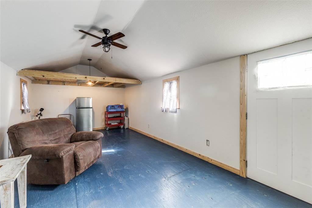 10615 Old Seagoville Road Dallas, TX 75217 - Photo 27 of 33 a living room with furniture and a window