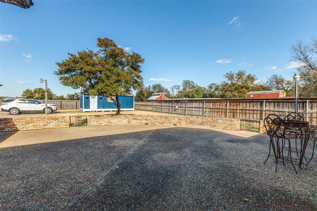 10615 Old Seagoville Road Dallas, TX 75217 - Photo 28 of 33 a view of lake with a table and chairs