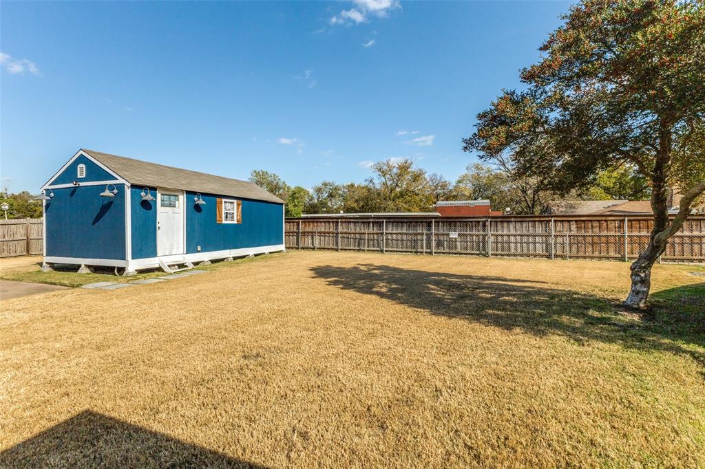 10615 Old Seagoville Road Dallas, TX 75217 - Photo 29 of 33 a view of a house with a wooden deck