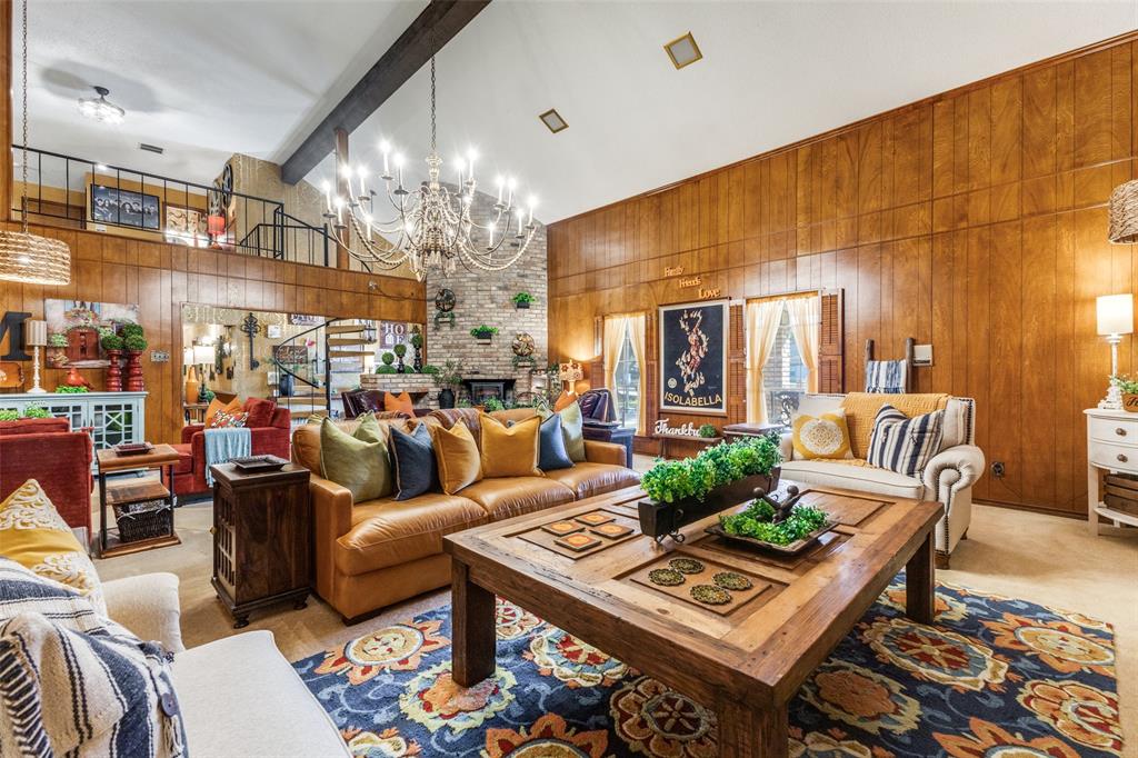 10615 Old Seagoville Road Dallas, TX 75217 - Photo 7 of 33 a living room with furniture a chandelier and a dining table