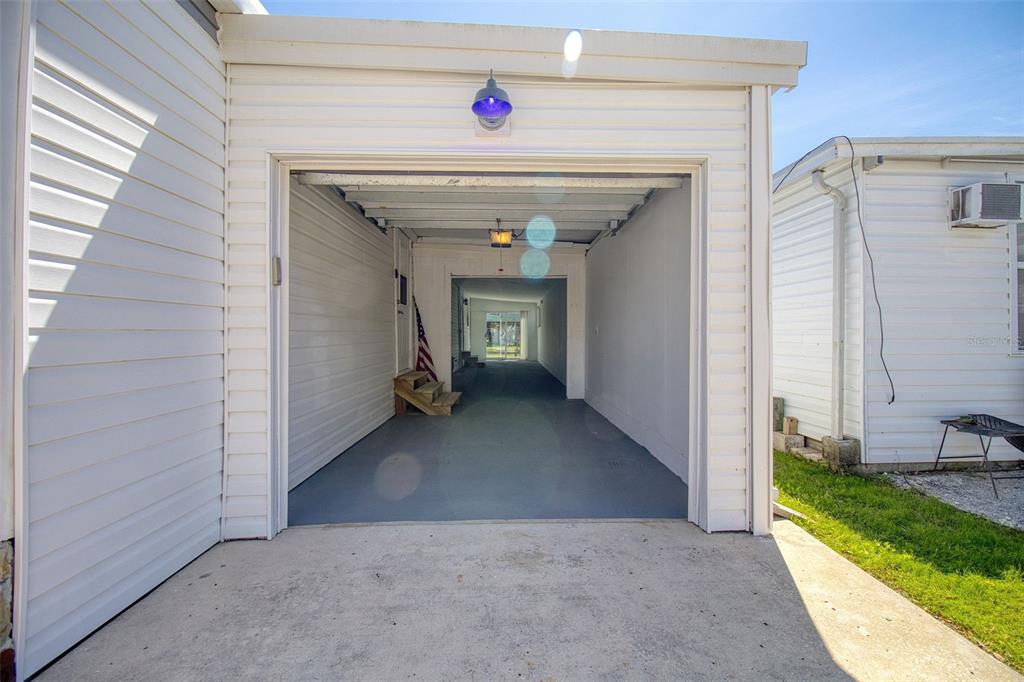 6820 Sea Ranch Drive Hudson, FL 34667 - Photo 21 of 29 a view of a hallway with wooden walls and a window