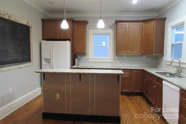 a kitchen with wooden cabinets and a sink