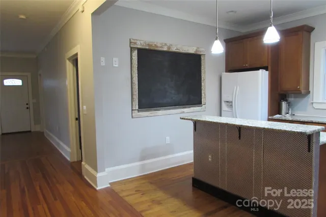 a bathroom with a sink a mirror and a shower
