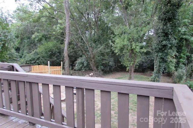a view of a small yard from a balcony
