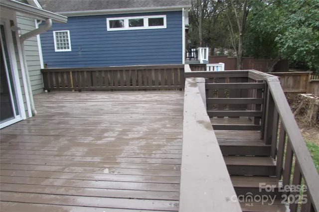 a view of a house with a door and a large window