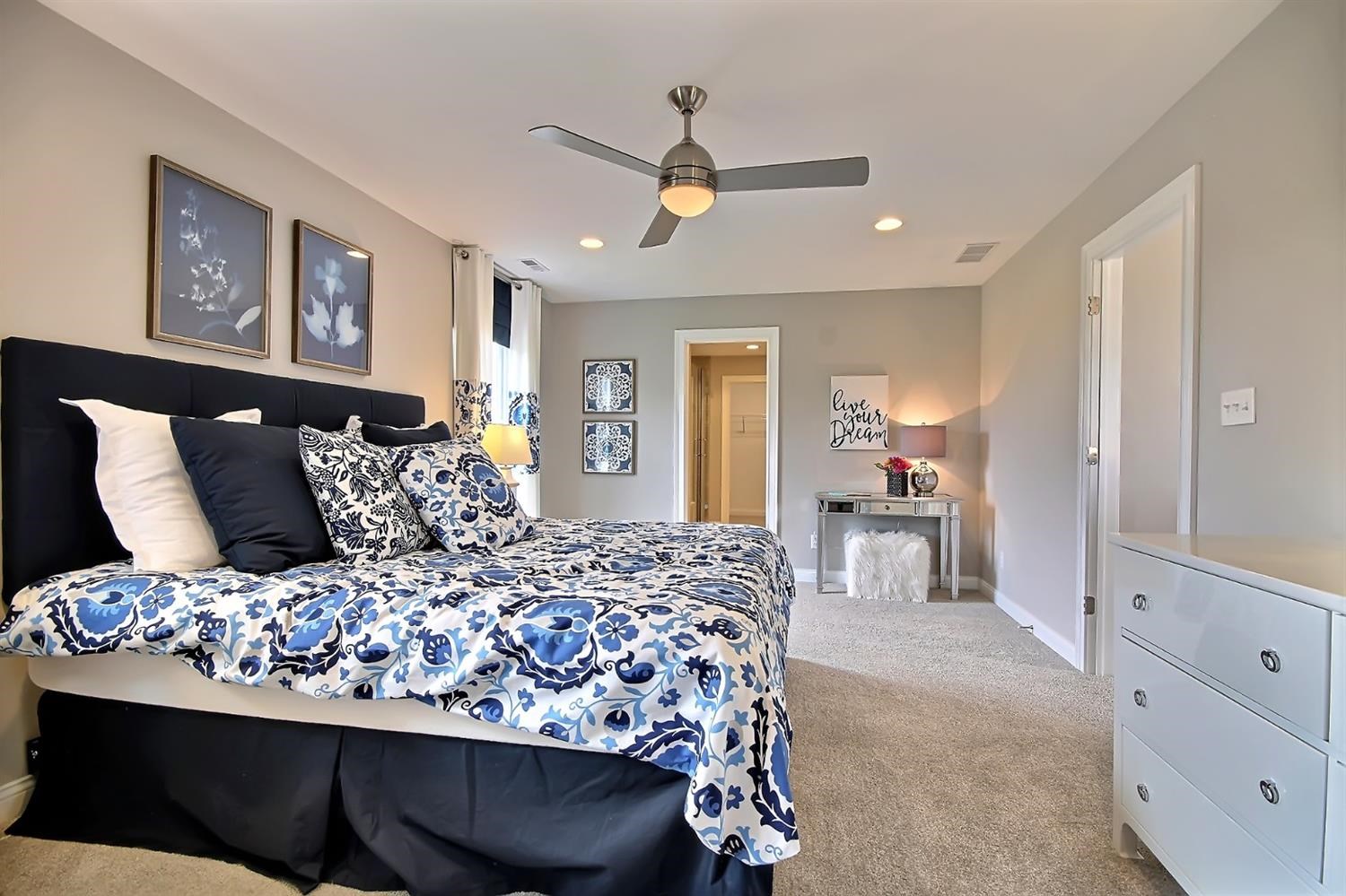 5740 Burr Rdg Circle Crown Point, IN 46307 - Photo 18 of 26 a bedroom with a large bed and a chandelier
