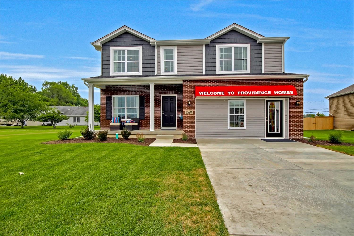5740 Burr Rdg Circle Crown Point, IN 46307 - Photo 2 of 26 a house view with a garden space