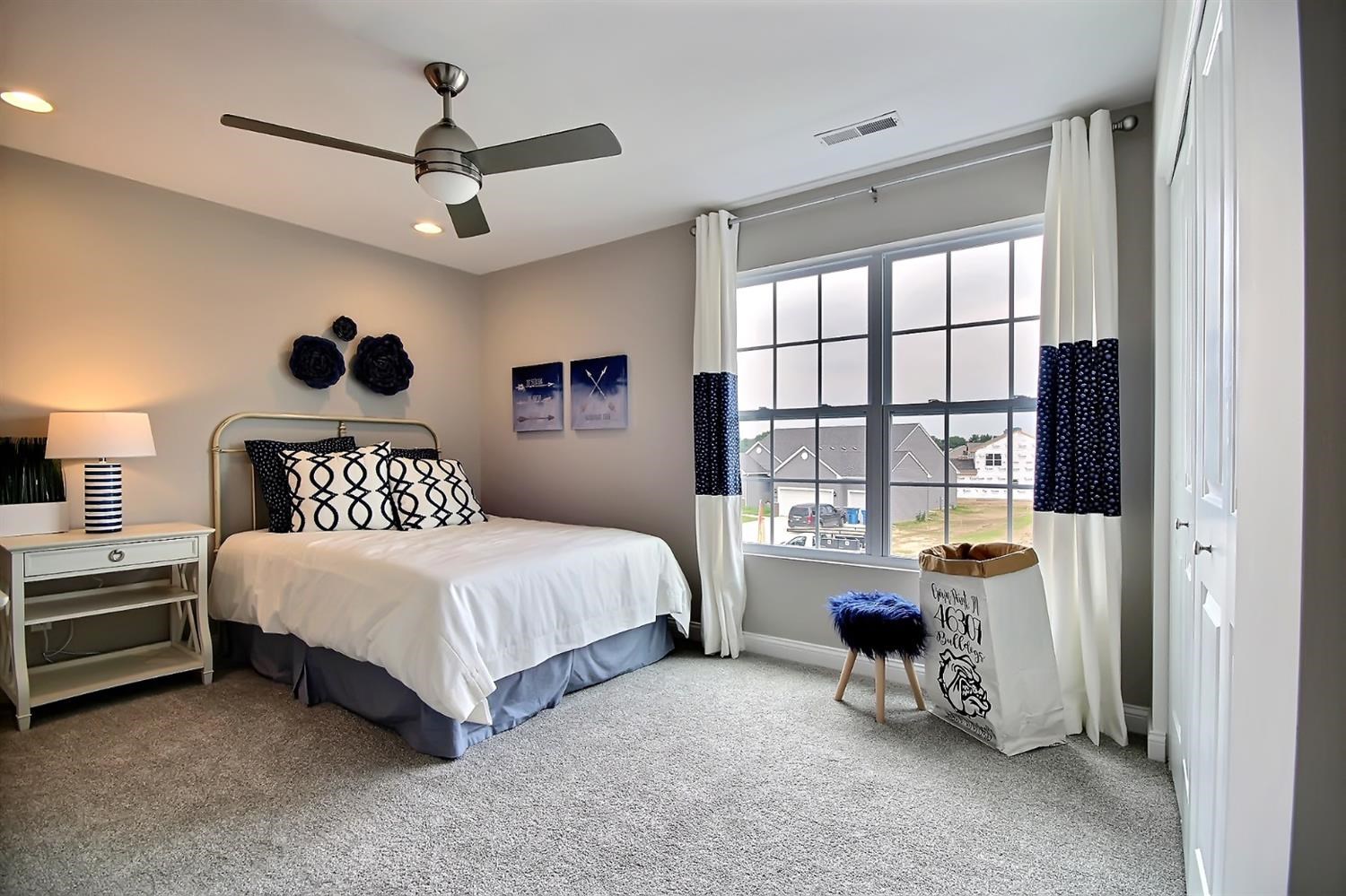 5740 Burr Rdg Circle Crown Point, IN 46307 - Photo 22 of 26 a spacious bedroom with a bed and a window