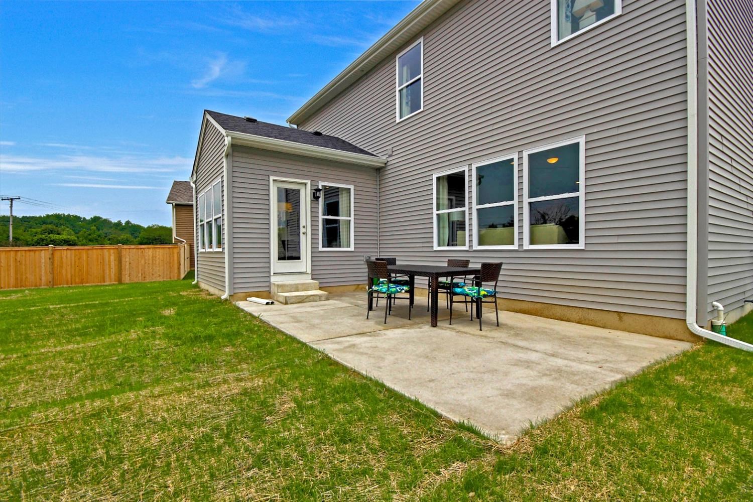 5740 Burr Rdg Circle Crown Point, IN 46307 - Photo 5 of 26 a view of a house with backyard and chairs
