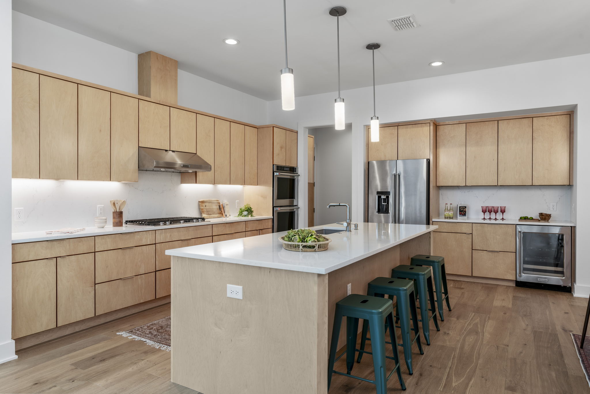 4602 Rue Street Austin, TX 78731 - Photo 13 of 39 a kitchen with stainless steel appliances granite countertop a sink a stove a refrigerator cabinets and chairs