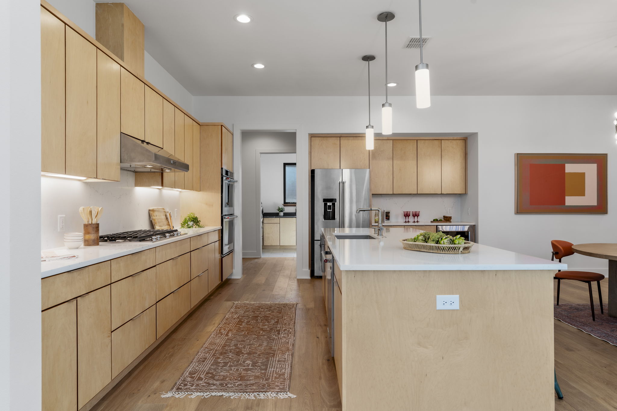 4602 Rue Street Austin, TX 78731 - Photo 17 of 39 a large kitchen with stainless steel appliances a lot of counter space and a sink