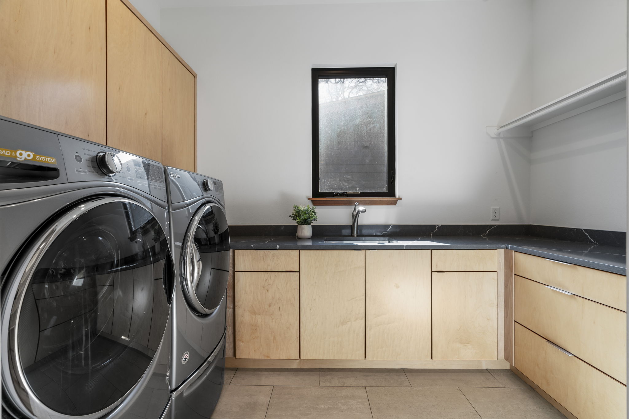 4602 Rue Street Austin, TX 78731 - Photo 18 of 39 a utility room with mirror and tiles