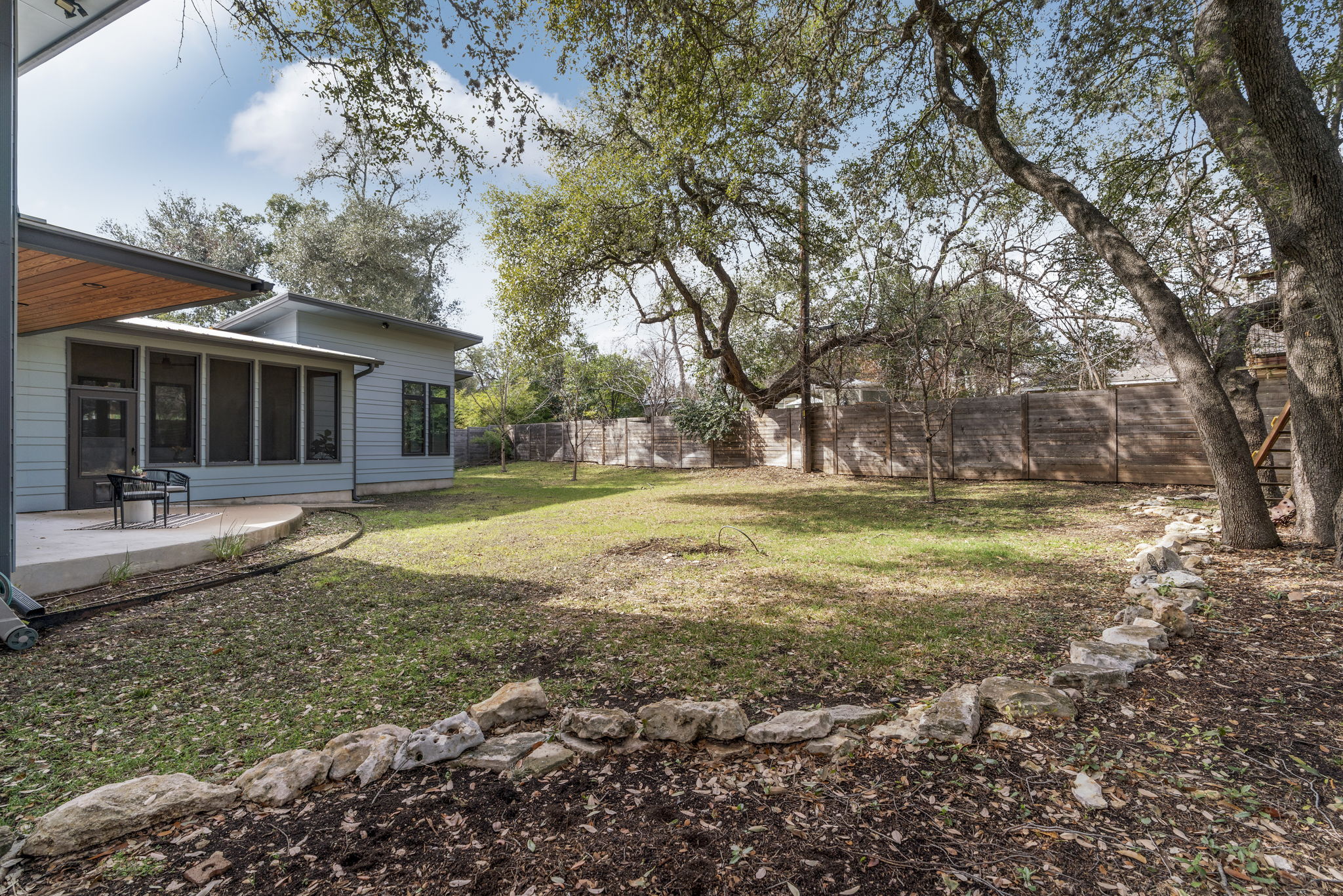 4602 Rue Street Austin, TX 78731 - Photo 35 of 39 a view of a house with a yard