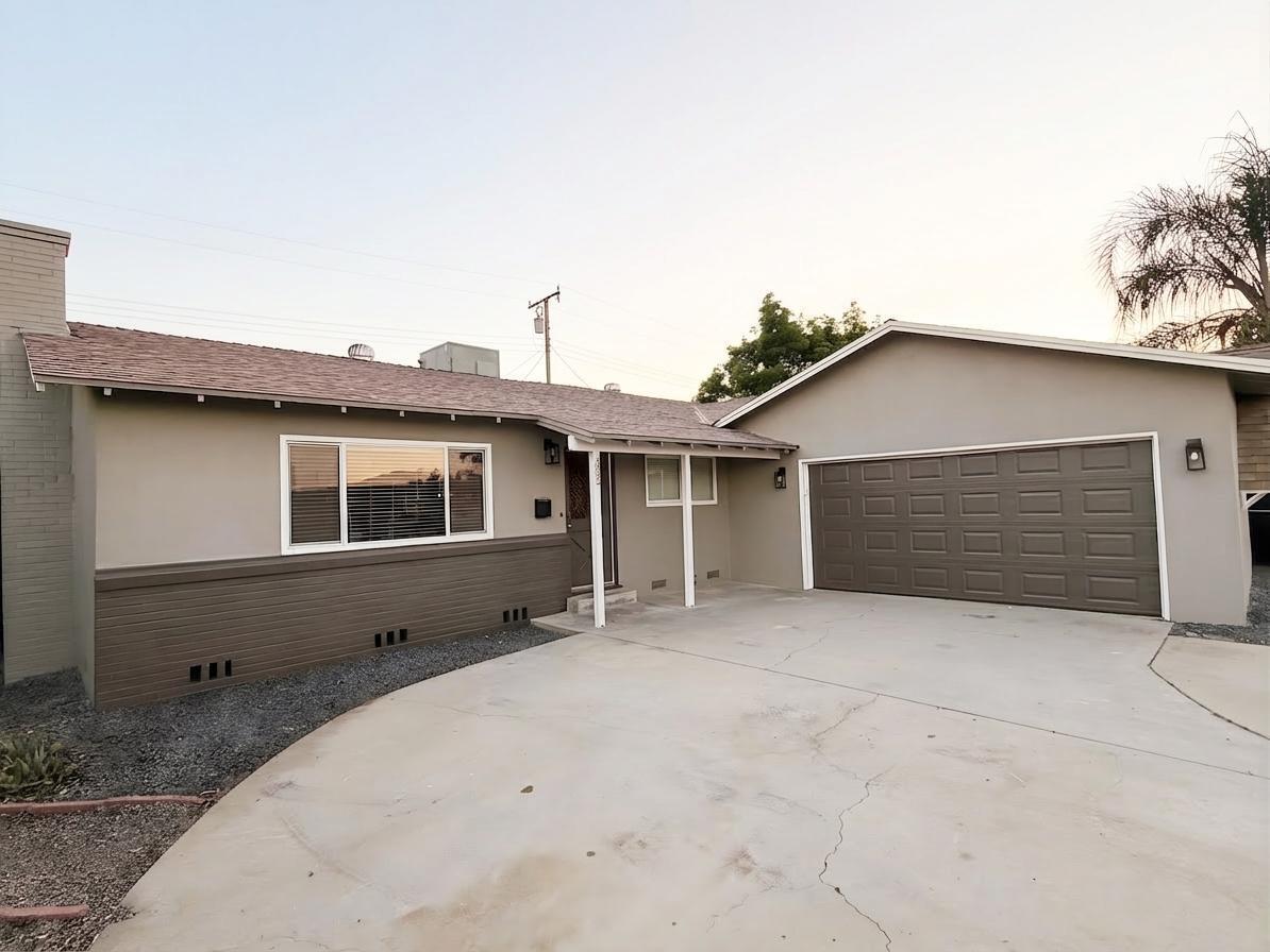 302 Sequoia Drive Exeter, CA 93221 - Photo 1 of 20 a front view of a house with garage