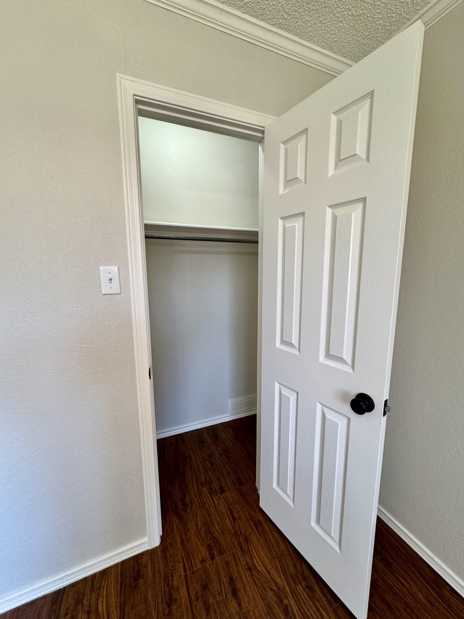 5421 94th Street Lubbock, TX 79424 - Photo 17 of 22 a view of front door with wooden floor
