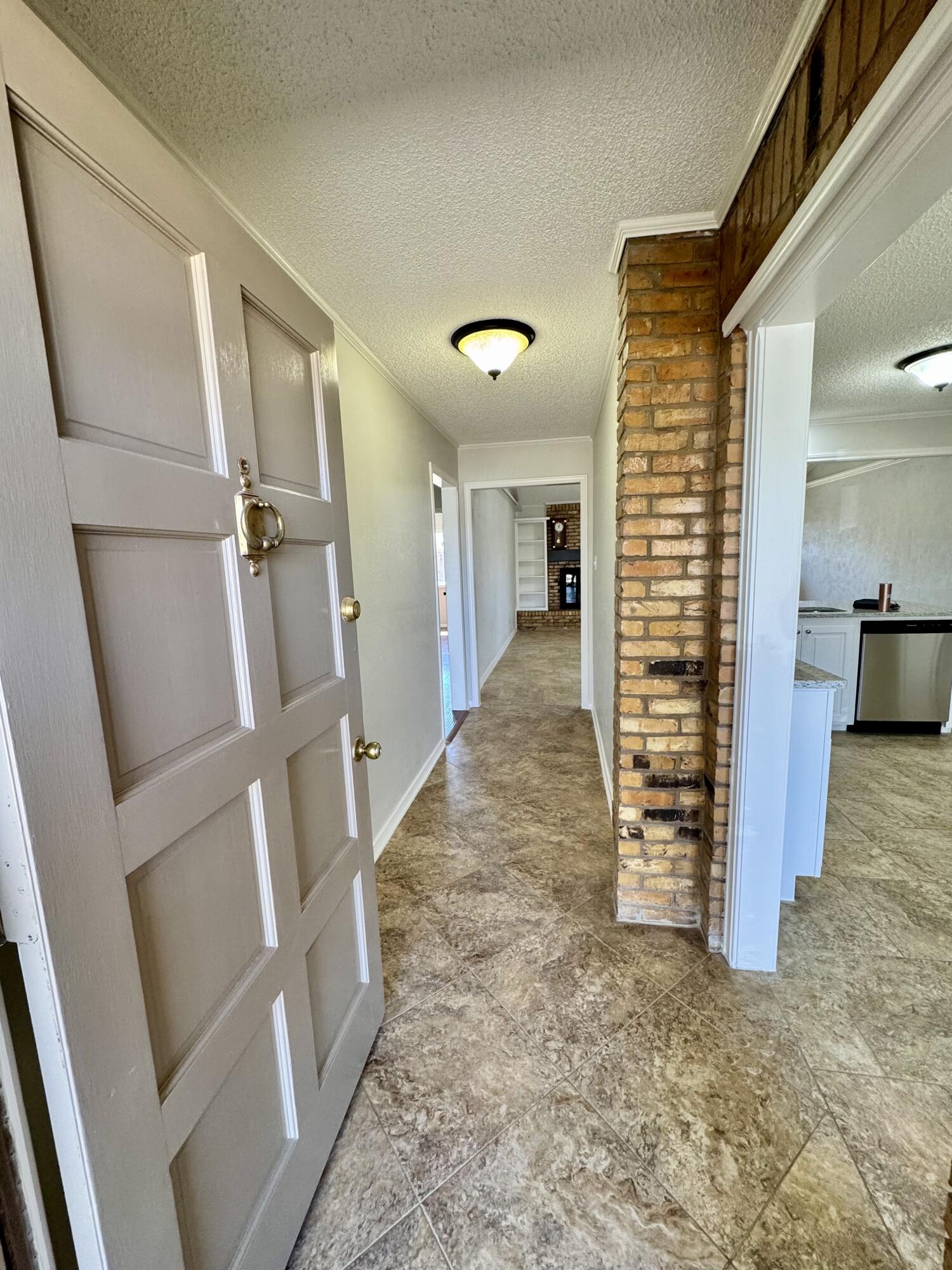 5421 94th Street Lubbock, TX 79424 - Photo 2 of 22 a view of entryway with wooden floor