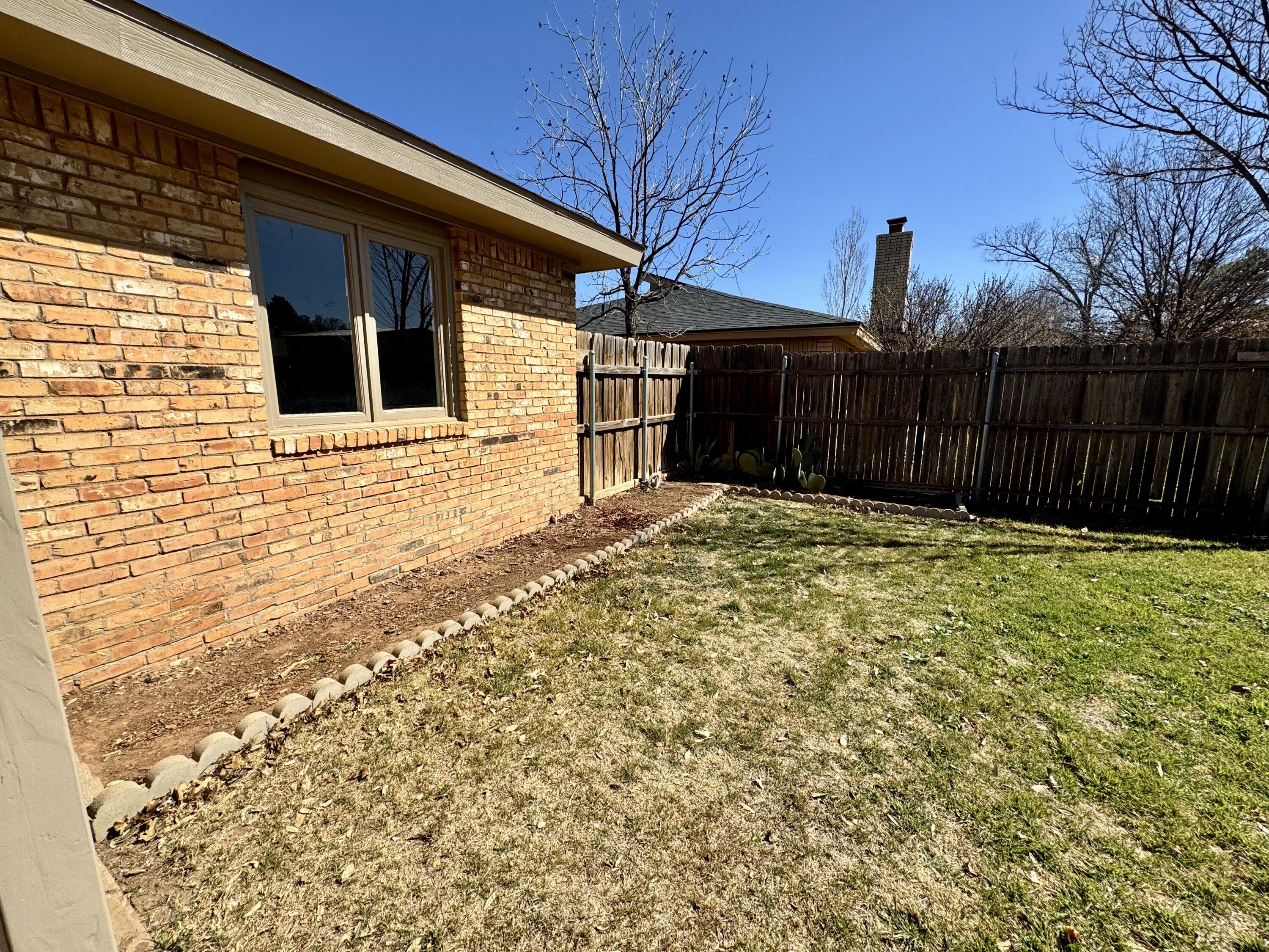 5421 94th Street Lubbock, TX 79424 - Photo 21 of 22 a view of a backyard of the house