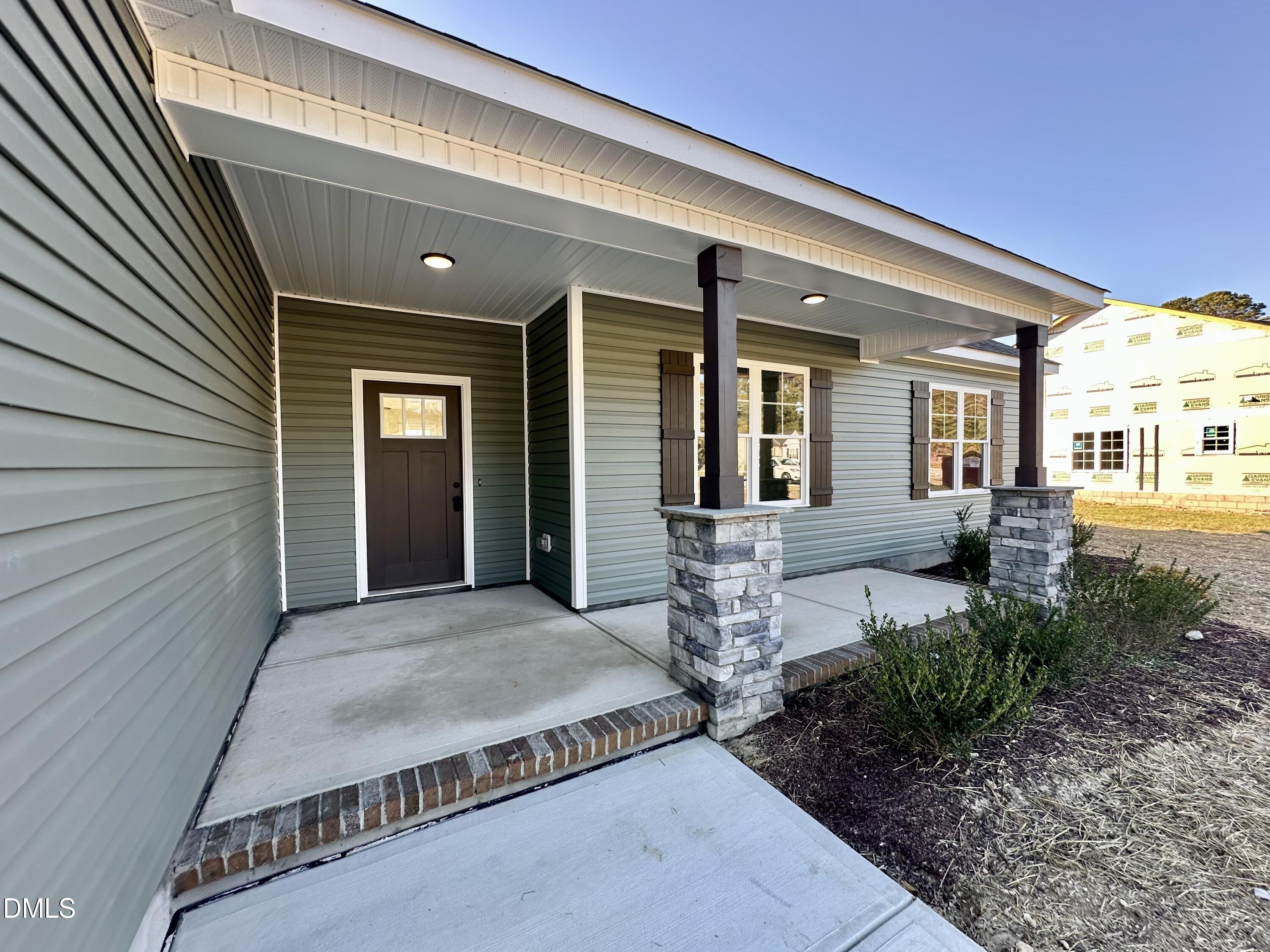 165 Bay Valley Road Kenly, NC 27542 - Photo 3 of 22 a front view of a house with garden