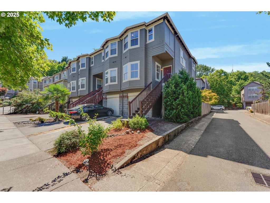 4815 Southwest 1st Avenue Portland, OR 97239 - Photo 1 of 43 a backyard of a house with a yard and outdoor seating