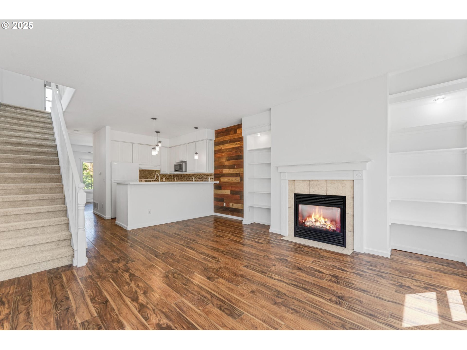 4815 Southwest 1st Avenue Portland, OR 97239 - Photo 12 of 43 a view of kitchen and empty room with wooden floor