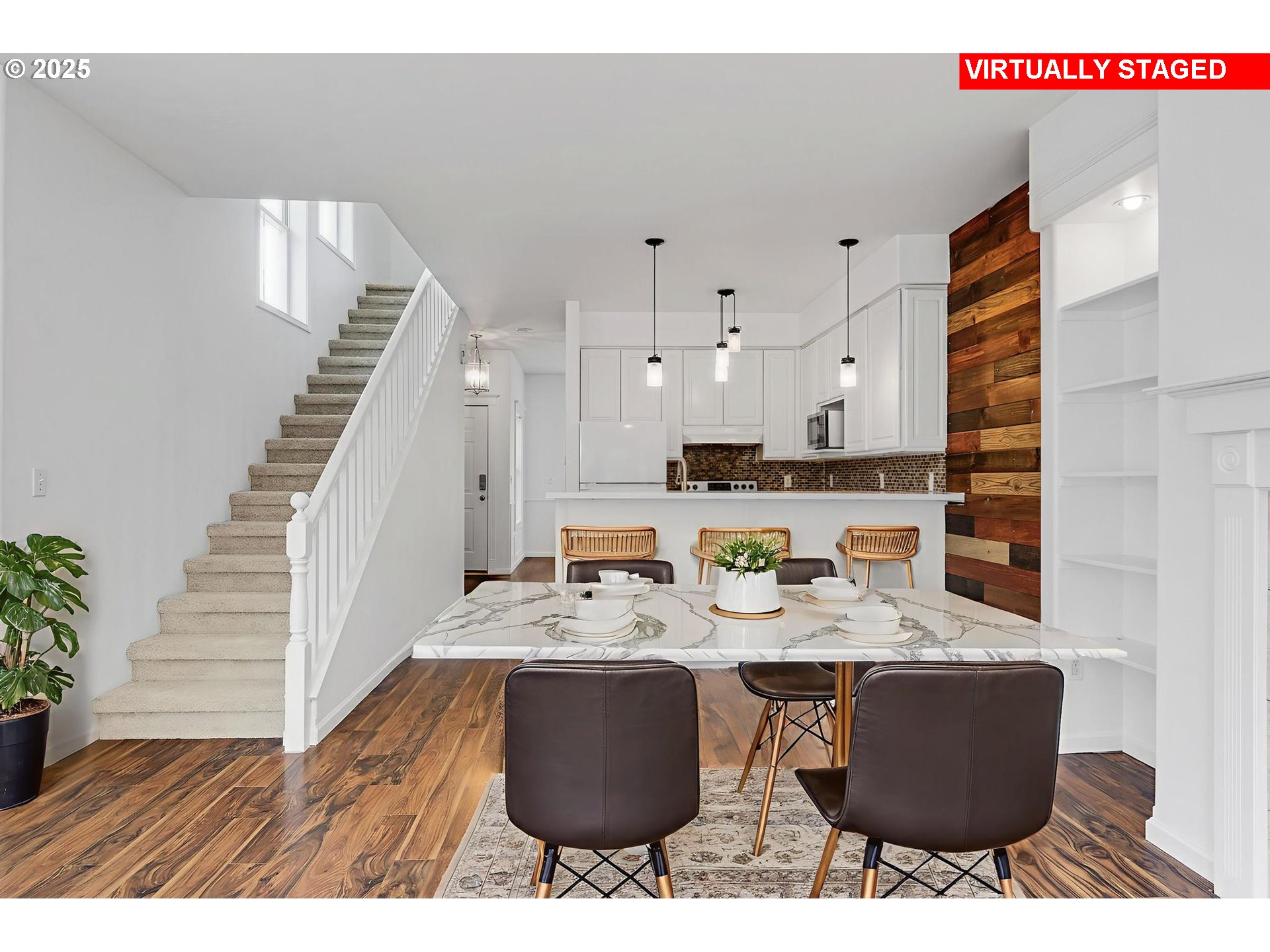4815 Southwest 1st Avenue Portland, OR 97239 - Photo 13 of 43 a view of kitchen with stainless steel appliances kitchen island sink stove and living room view