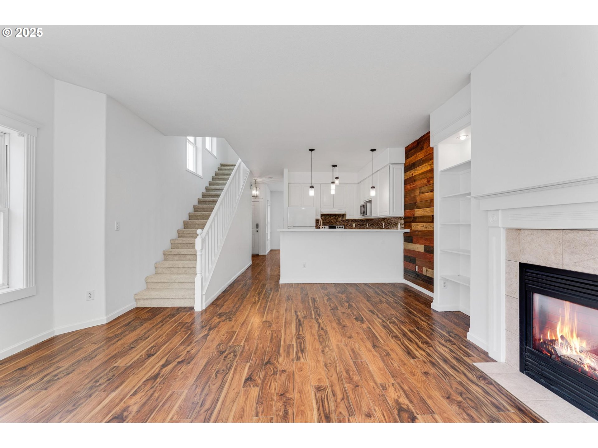 4815 Southwest 1st Avenue Portland, OR 97239 - Photo 14 of 43 a view of kitchen and hall with wooden floor