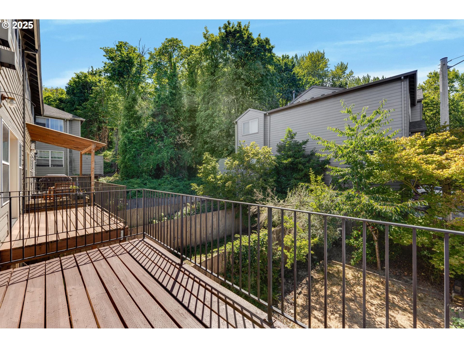 4815 Southwest 1st Avenue Portland, OR 97239 - Photo 16 of 43 a view of balcony with wooden floor and outdoor seating