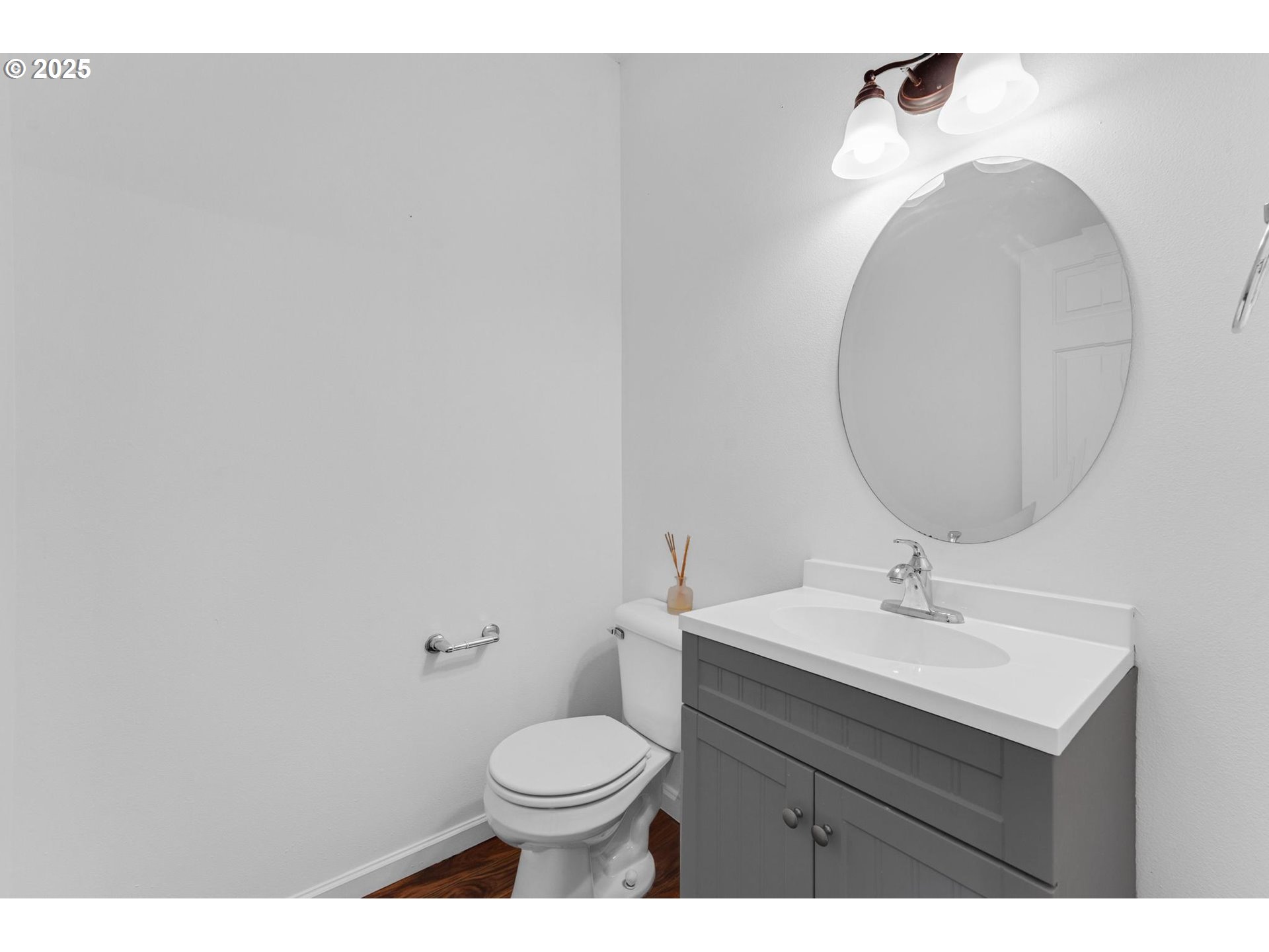 4815 Southwest 1st Avenue Portland, OR 97239 - Photo 17 of 43 a bathroom with a sink mirror and toilet