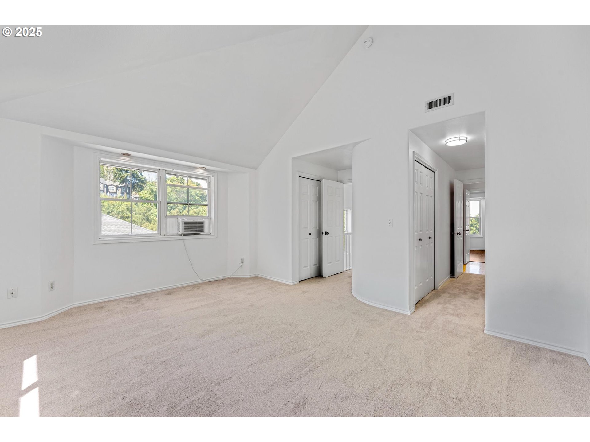 4815 Southwest 1st Avenue Portland, OR 97239 - Photo 21 of 43 a view of an empty room with a window