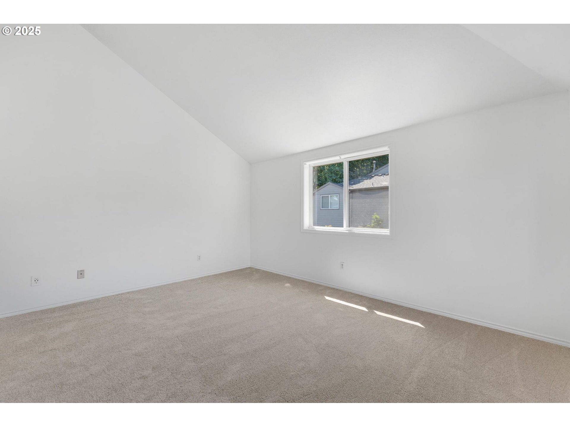 4815 Southwest 1st Avenue Portland, OR 97239 - Photo 25 of 43 an empty room with a window