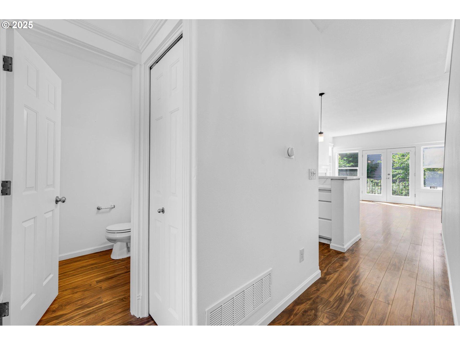 4815 Southwest 1st Avenue Portland, OR 97239 - Photo 3 of 43 a view of an empty room and wooden floor