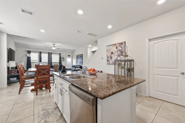 a kitchen with kitchen island granite countertop lots of counter top space