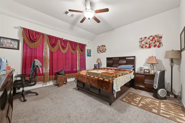 a bedroom with a bed and a table