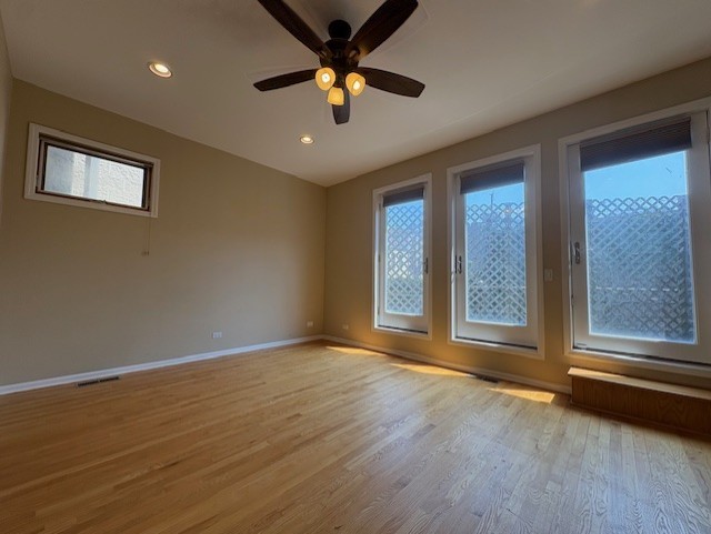 1543 North Hudson Avenue, Unit 2 Chicago, IL 60610 - Photo 13 of 19 a view of an empty room with a window and wooden floor