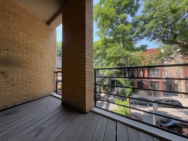 a view of a balcony with an outdoor space
