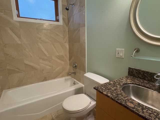 1543 North Hudson Avenue, Unit 2 Chicago, IL 60610 - Photo 9 of 19 a bathroom with a granite countertop toilet sink and bathtub