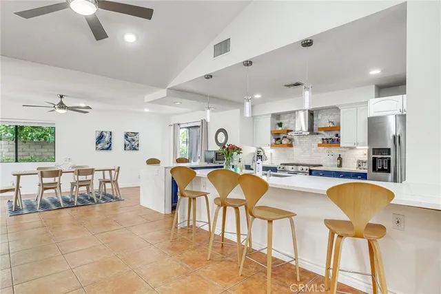 a view of a livingroom with furniture window and wooden floor