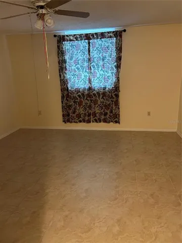 a view of a room with wooden walls