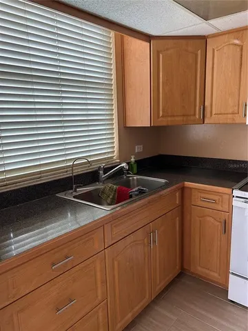 a kitchen with a sink and cabinets