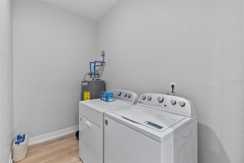 9155 Agate Street Port Charlotte, FL 33981 - Photo 15 of 30 a utility room with dryer and washer