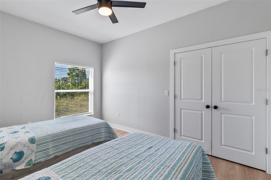 9155 Agate Street Port Charlotte, FL 33981 - Photo 16 of 30 a bedroom with a bed and a window
