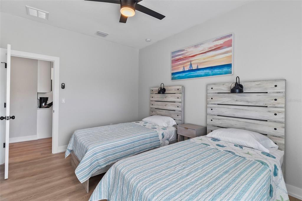 9155 Agate Street Port Charlotte, FL 33981 - Photo 17 of 30 a bedroom with two bed and a flat screen tv