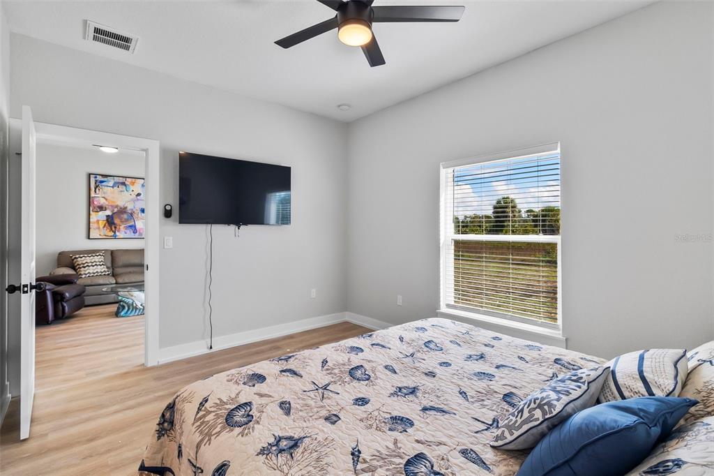 9155 Agate Street Port Charlotte, FL 33981 - Photo 20 of 30 a bedroom with a bed and a flat screen tv